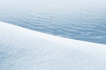 Fototapeta na wymiar Fresh snow background texture. Winter background with snowflakes and snow mounds. Snow lumps