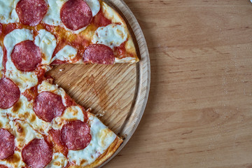 Homemade pizza pepperoni, traditional italian pizza, tomato sauce, mozzarella cheese, salami