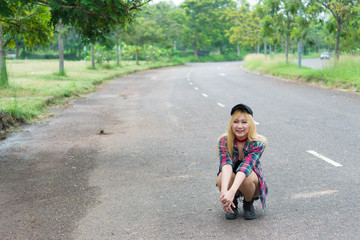 Asian hipsters girl posing for take a photo on the road,lifestyle of modern woman,Thai people in hippie style