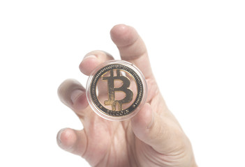 Golden Bitcoin Crypto Currency holding hand