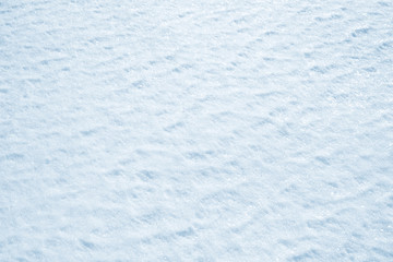 Fresh snow background texture. Winter background with snowflakes and snow mounds.