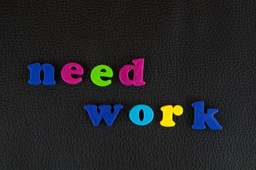 Need work written in   a mix of colourful plastic letters  on black leather. 