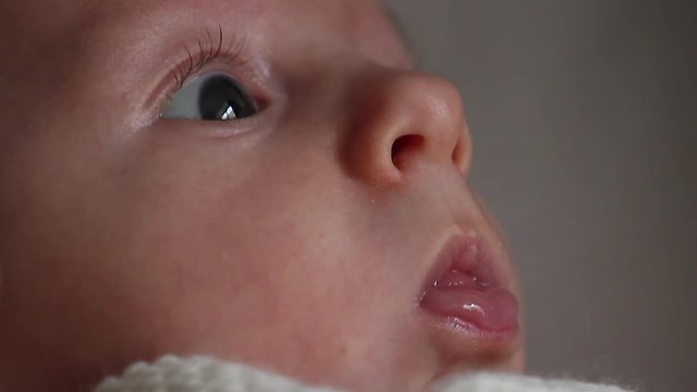 Side View Portrait Of One Month Old Newborn Baby Boy - Close Up