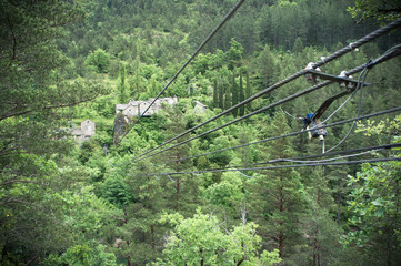 A few stone houses hidden in deep forest of Tarn gorge