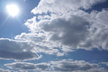 blue sky with clouds and sun
