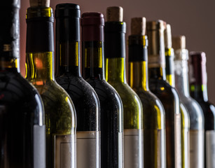Line of wine bottles. Close-up.