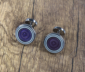 cufflinks on the wooden background