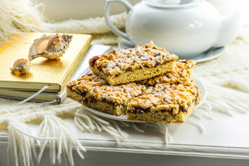 Homemade cookies, pie with jam, diaries with records on the window. The concept of a warm and cozy home interior. Memories of summer.
