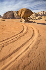 car trails on the sand in desert in Jordan