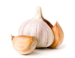 Garlic and slice on a white, close up.