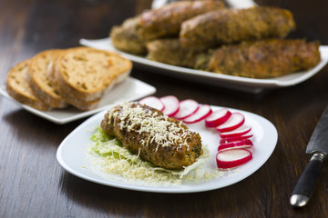 pork roulades stuffed with spinach sprinkled with freshly grated horseradish