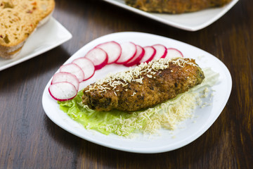 pork roulades stuffed with spinach sprinkled with freshly grated horseradish