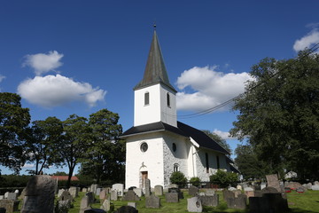 Fototapeta na wymiar Church in Norway on sunny weather and blue sky