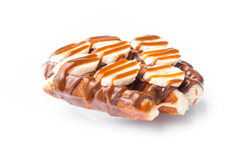 Belgian waffles with banana on white background