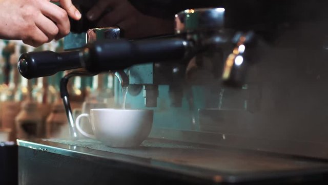 Man Preparing Coffee at Coffee Machine