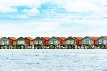 Water villas on tropical caribbean island, Maldives. Copy space for text.