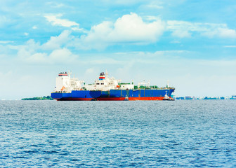Fototapeta premium View of merchant ships in the Indian ocean, Male, Maldives. Copy space for text.