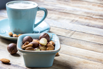 Cup of latte coffee on wooden background
