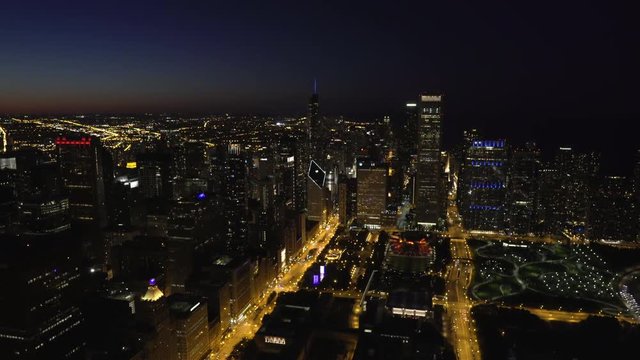 Chicago wide angle aerial view of the Silhouetted Chicago Skyline shot above the magnificent mile and Grant Park