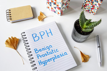 BPH Benign Prostatic Hyperplasia written in a notebook on white table