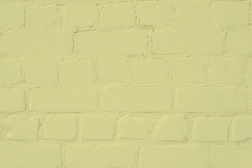 the surface of the brickwork is painted with yellow paint