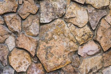 masonry from a natural stone in the street