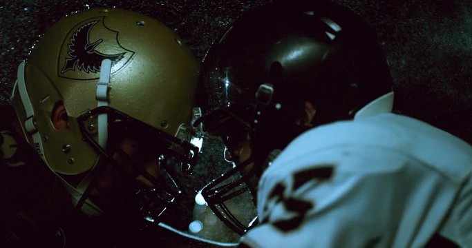 American football players in stadium during game