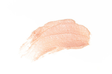 Light pink cosmetics products on white