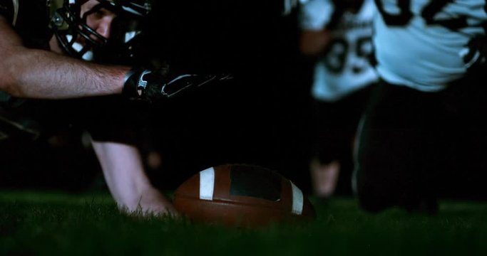 American football players in stadium during game