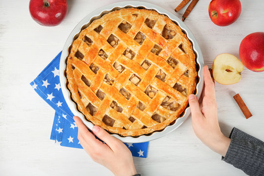 Woman With American Apple Pie At Table