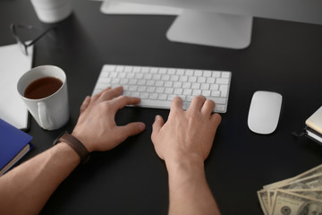 Man working with computer in office. Forex concept