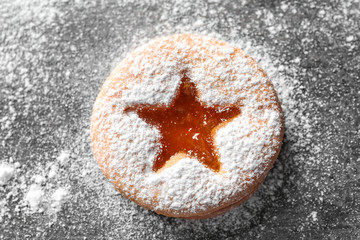 Tasty Linzer cookie with jam on table