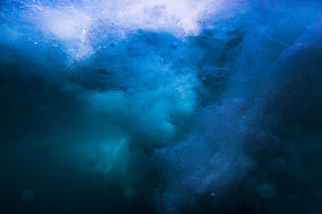 Fototapeta na wymiar Wave underwater. Blue ocean in underwater
