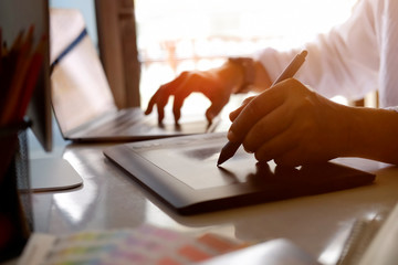 Graphic designer working in studio.