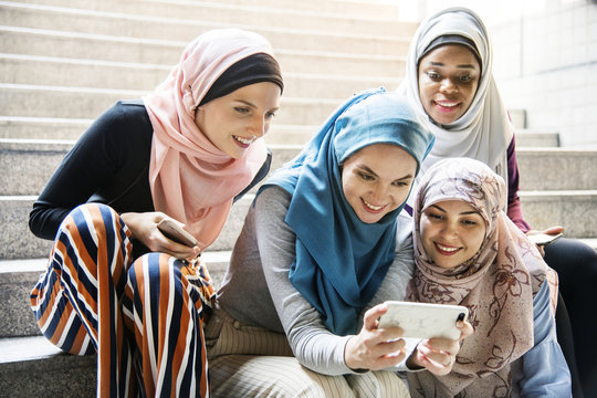 Group of islamic women looking at smartphone