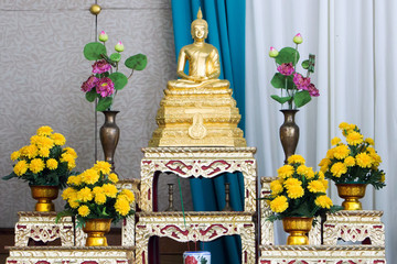 Buddha statue of meditation located on the altar of worship.