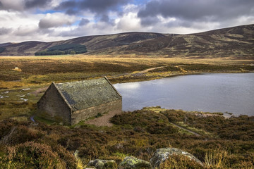 Boat house at Loch Muick, Ballater, Scotland, UK. Royal Deeside and Cairngorm Mountains, one of the most beautiful parts of Scotland. October 2017
