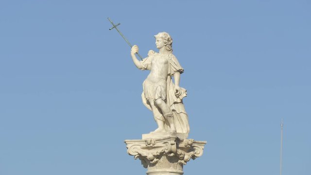 Close up of a statue holding a sword
