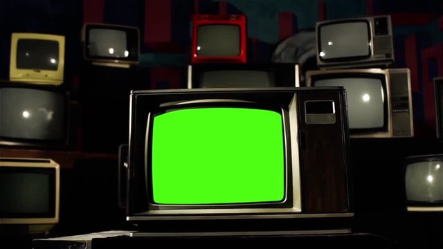 Retro Tv Green Screen in the Middle of Many Tvs. Contrasted Tone. You can replace green screen with the footage or picture you want with “Keying” effect in AE (check out tutorials on YouTube). 