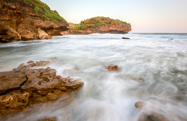 Amazing view of Yogyakarta seascape with natural coastal rock as foreground