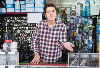 Portrait of adult male choosing electrical installation products
