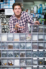 Employee selling nuts, screw and fasteners