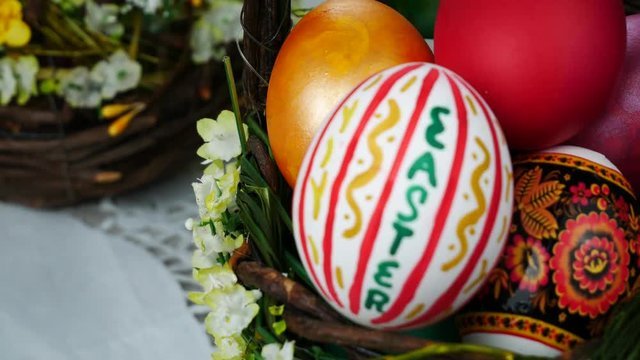 Multi colors easter eggs in the spring bascket
