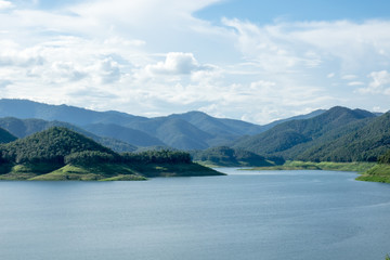 Fototapeta na wymiar Lake with blue sky clouds background