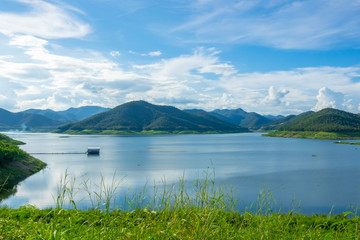 Fototapeta na wymiar Lake with blue sky clouds background