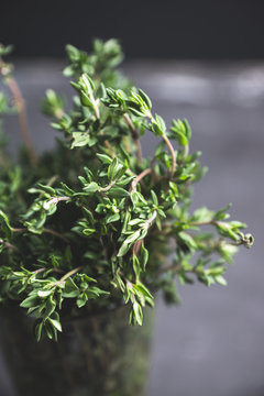 Fresh green thyme in the glass. Selective focus.