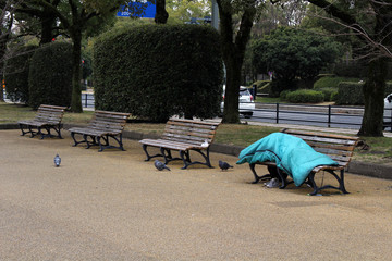 Homeless in the city center of Hiroshima, Japan. Sleeping in the park.