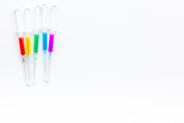 Syringe with medicine. Injection concept on white baclground top view copy space