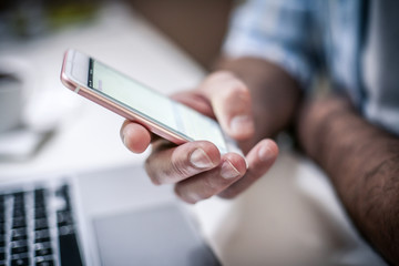 Hand holding smart phone.