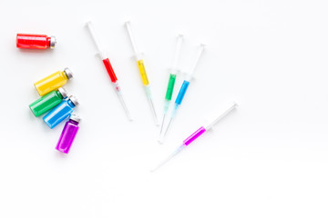 Syringe with medicine. Injection concept on white baclground top view copy space